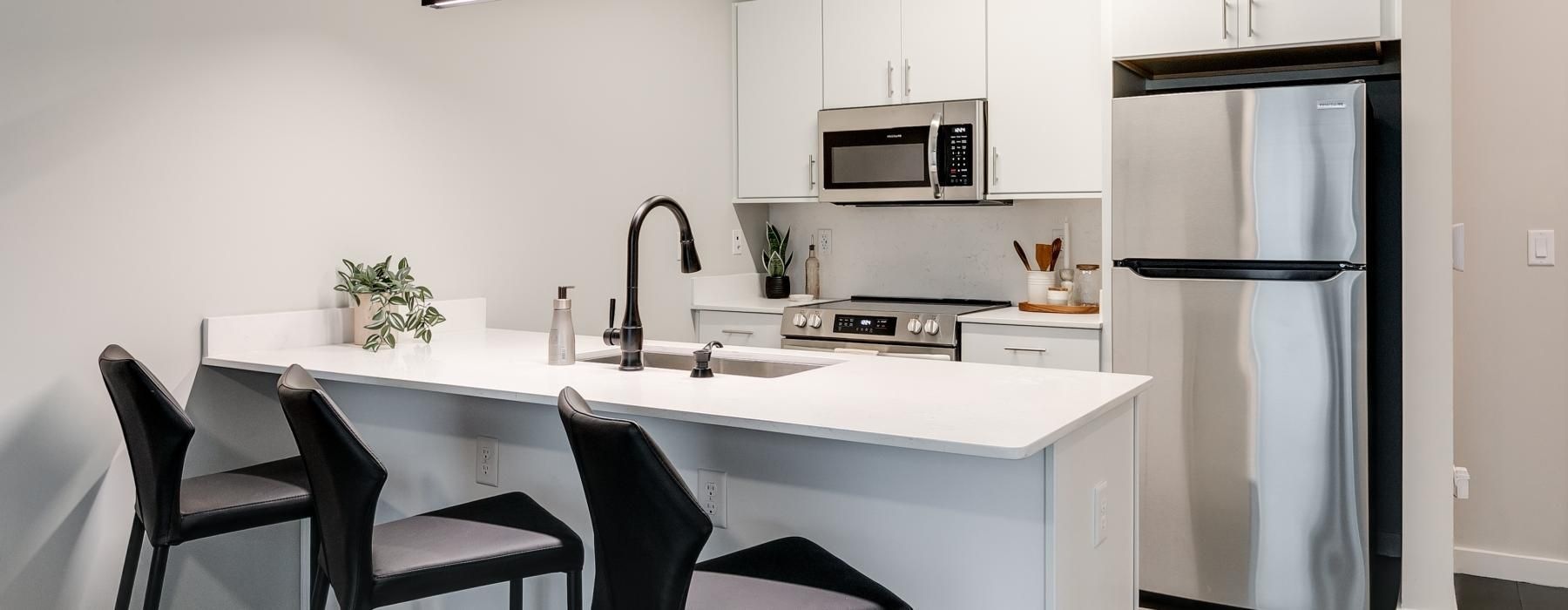 a spacious kitchen with a large island