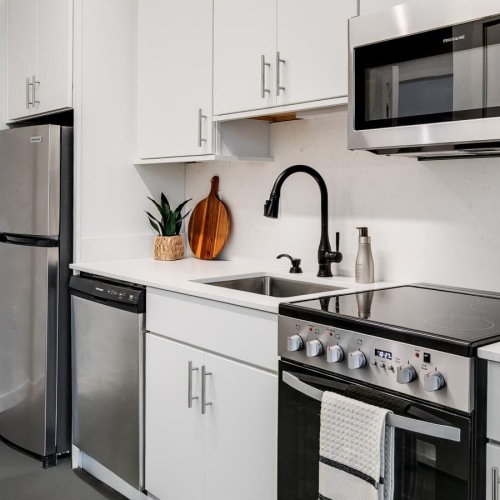 a kitchen with white cabinets