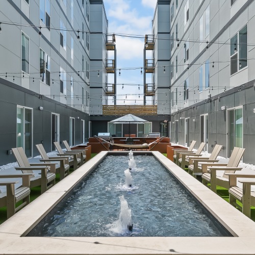 courtyard with fountains and chairs