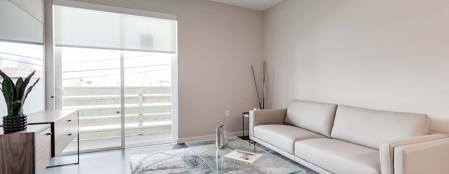 a living room with a glass door