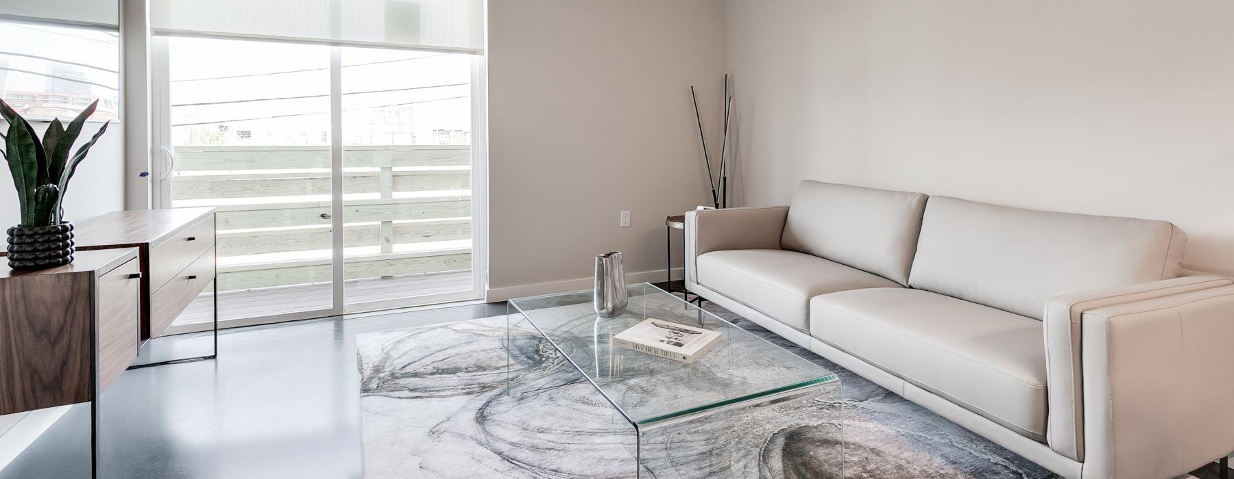 a living room with a glass door