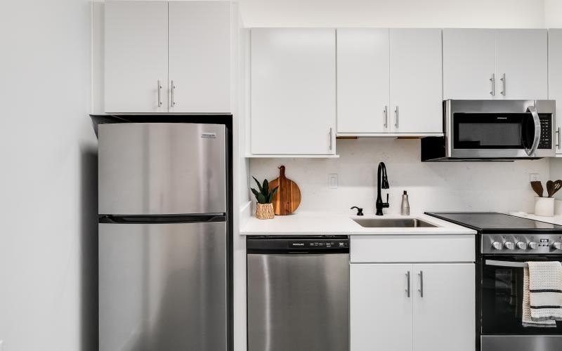 a kitchen with white cabinets